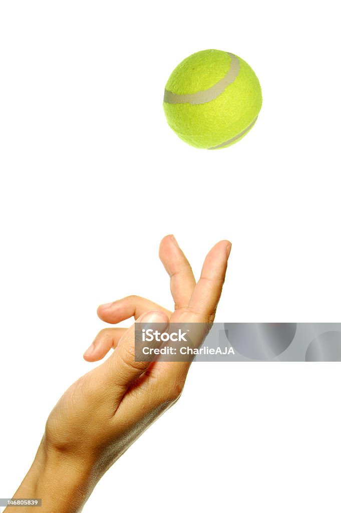 Tennis Hand tossing a tennis ball in preparation to serve Close-up Stock Photo