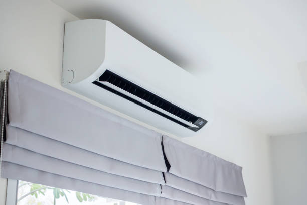 istock Air conditioner on white wall room interior background 1468059938