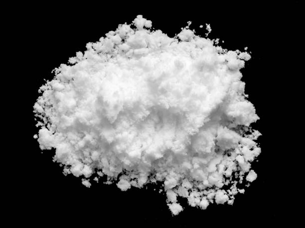 istock White snow isolated on black background close up 1468060269
