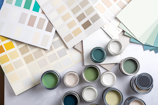 Paint color swatches in the background interior design studio. Selection Various colors and shades of paint for interior design and decoration works. High quality photo