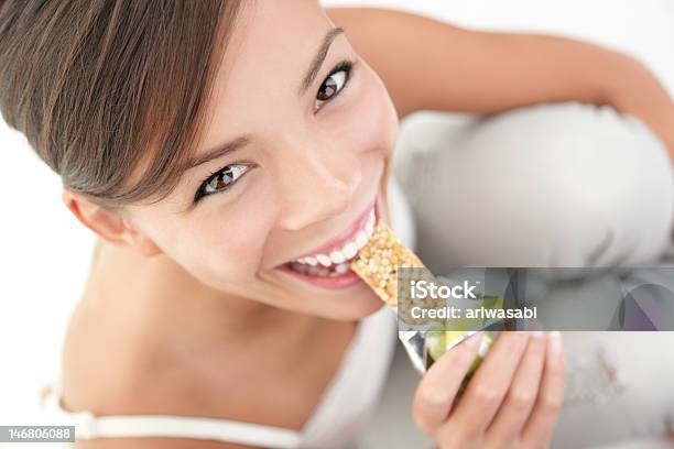 Snack Eating Woman Stock Photo - Download Image Now - Protein Bar, Biting, Women