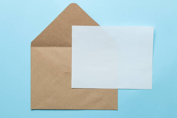 istock Craft envelope and blank for text on a bright trendy light blue background. top view 1468061490
