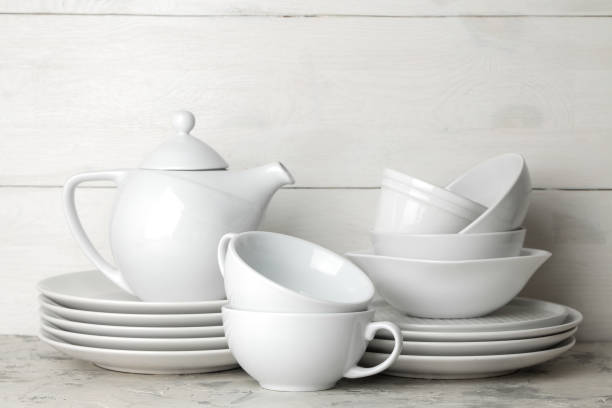 istock a lot of different dishes. Dinnerware. on a light concrete background. dishes for serving the table. various plates, bowls, and cups. 1468061580