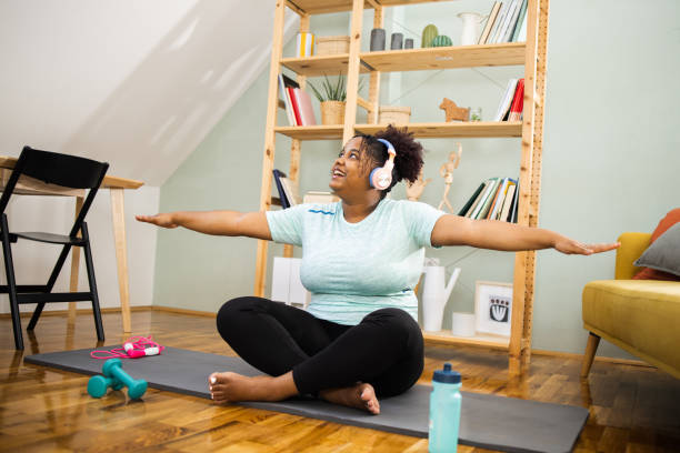 istock Happy young woman exercising 1468062374