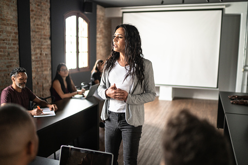 Transgender woman talking during a class or seminar