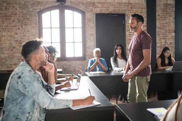 istock Mature man teaching in a classroom or seminar 1468064149
