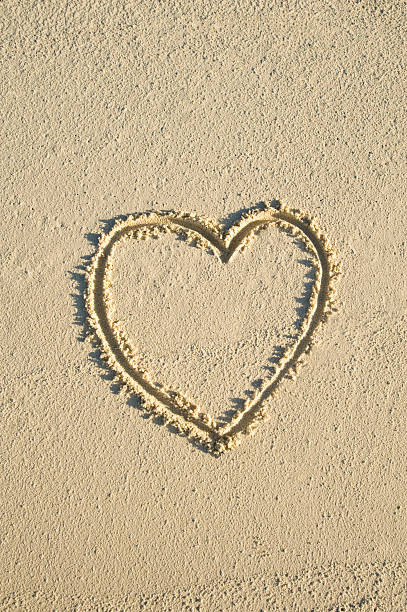 Heart on the sand stock photo