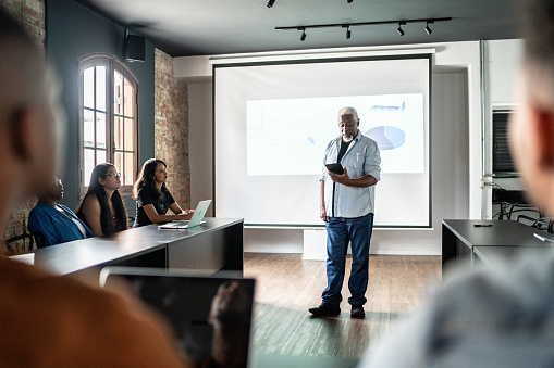 Senior man doing a presentation