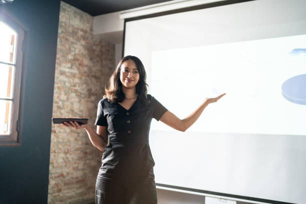 istock Mid adult businesswoman doing a presentation 1468065715