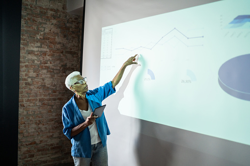 Senior woman doing a business presentation