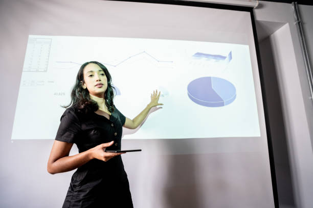 istock Mid adult woman doing a presentation 1468068791