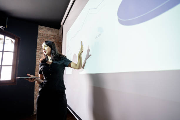 istock Mid adult woman doing a presentation 1468068799