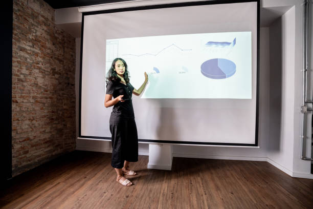 istock Mid adult woman doing a presentation 1468068804