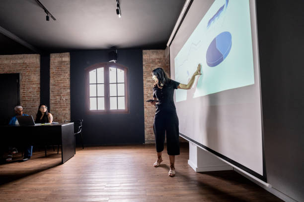 istock Mid adult woman doing a presentation 1468068814
