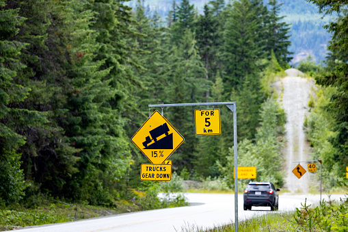 Steep Hill Descent Use Low Gear Traffic Sign on the Highway 99 near Whistler, British Columbia, Canada
