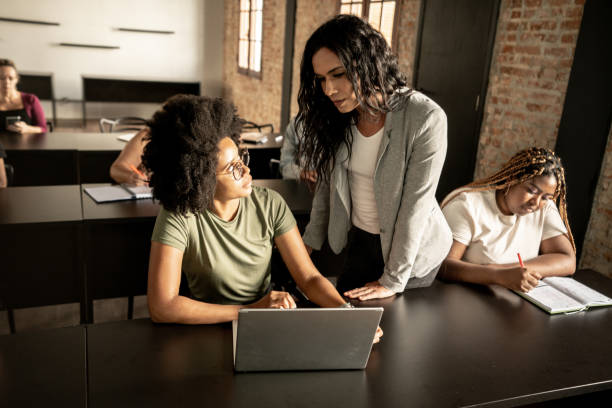 istock Transgender woman helping student in a classroom 1468068993