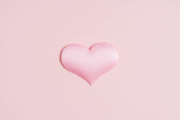 istock Background pink heart on peach colored paper 1468069200