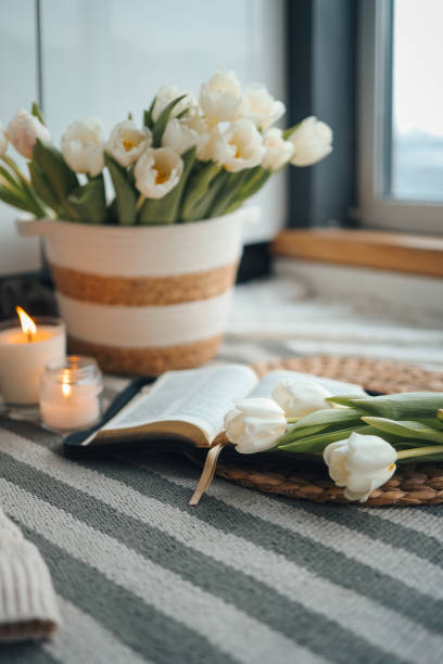 istock Bible, tulips and candles, cozy home atmosphere 1468069841