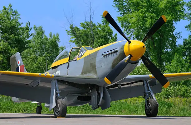 A P-51D Mustang in RCAF colours is readied for flying.