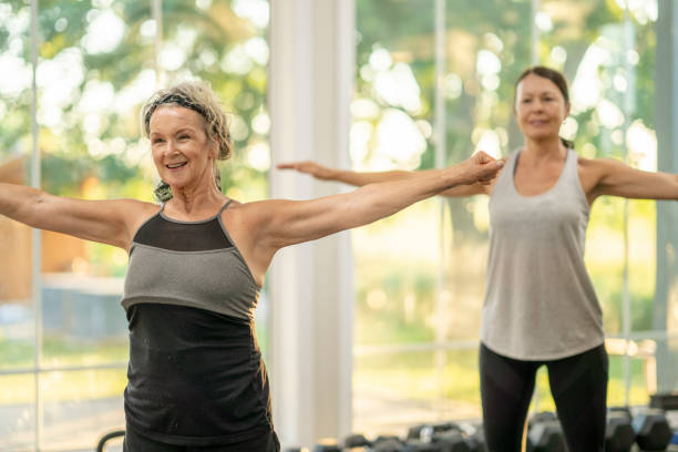 istock Senior Women Practicing Yoga 1468071876