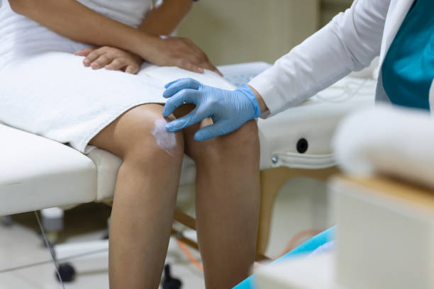 istock Doctor applying ointment to a patient's scar 1468074895
