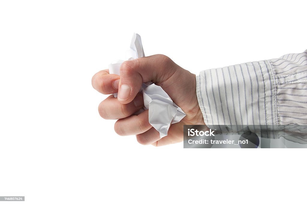 hand in business crumpling a piece of paper young man's hand with a white business shirt sleeve - isolated on white Adult Stock Photo