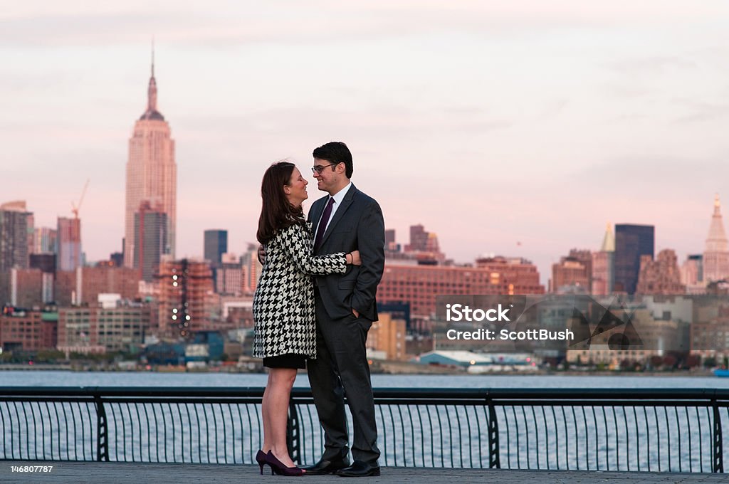 Skyline couple A dressed up couple together with the New York City skyline in the background Empire State Building Stock Photo