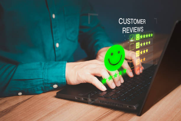 istock Businessman hand using computer laptop with popup five star icon for feedback review satisfaction service and testimonial. Customer service experience and business satisfaction survey. 1468078193