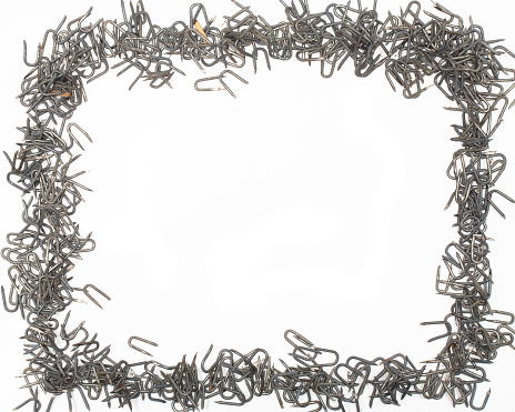 artistic borders and frames featuring a construction, tool, hardware, focus, barbed wire staples used to attach barbed wire to a fence post