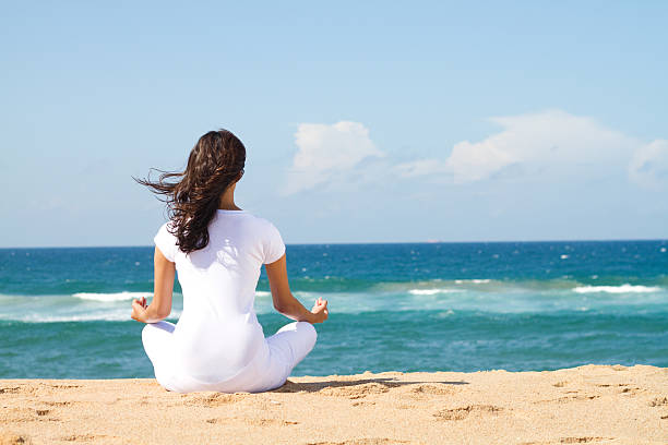istock yoga meditation on beach 146807859