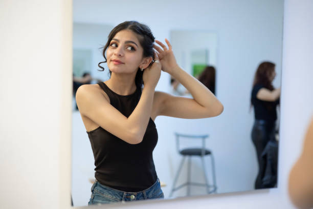 istock Woman combing her hair 1468078719