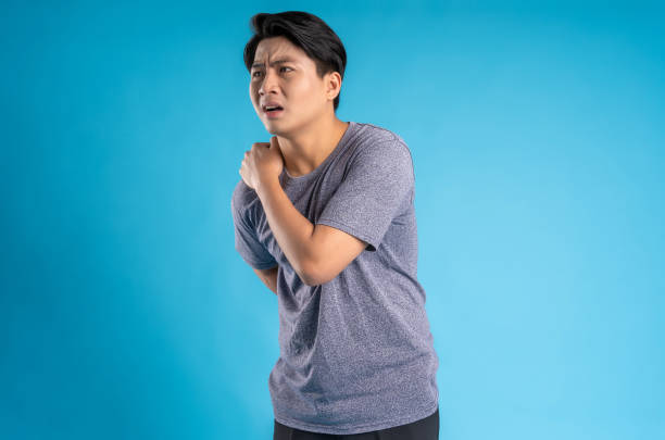 istock Asian young man posing on blue background 1468083468