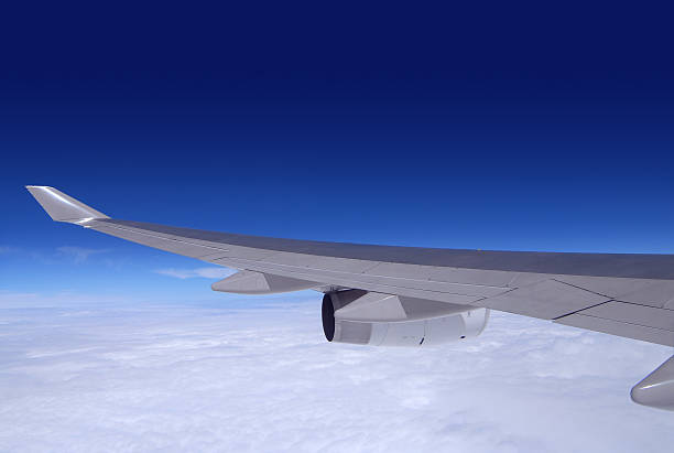 Boeing 747 Wing and engine of passenger jet stock photo