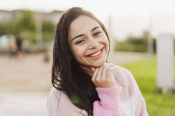 istock Smiling woman with hand on chin. 1468087592