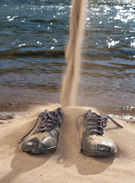 Areia em Meus calçados - foto de acervo