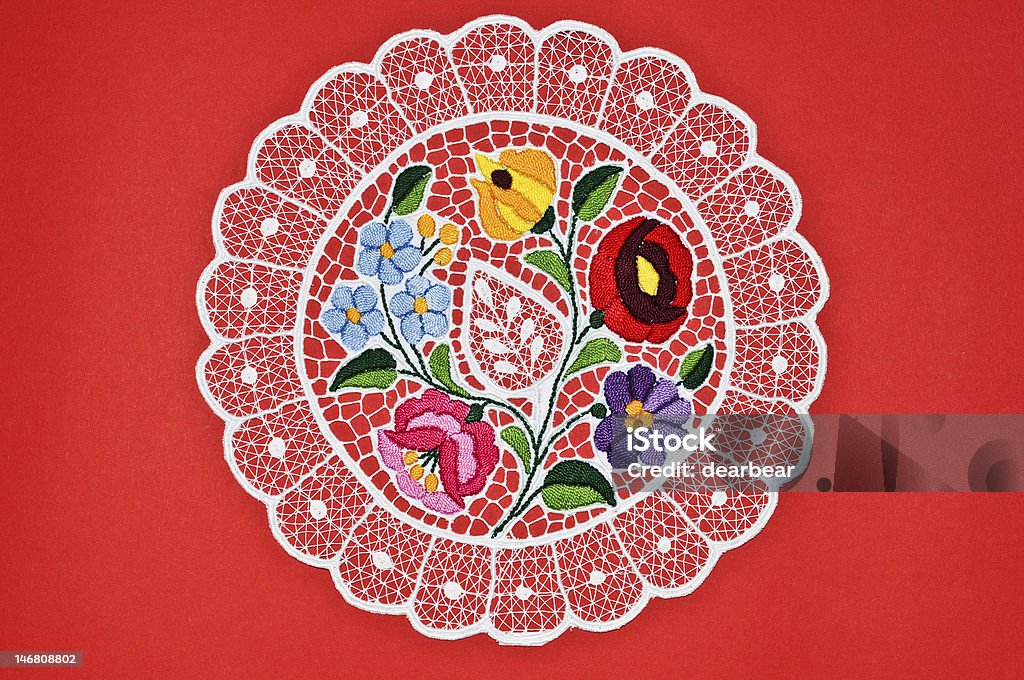 Hungarian circle embroidery Small round embroidery table cloth with native Hungarian flower texture Embroidery Stock Photo