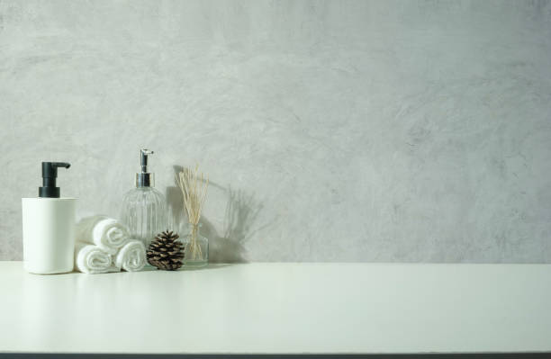 istock Various spa items with essential oils, towels, herbal compress balls on white table. Copy space for text. 1468089764