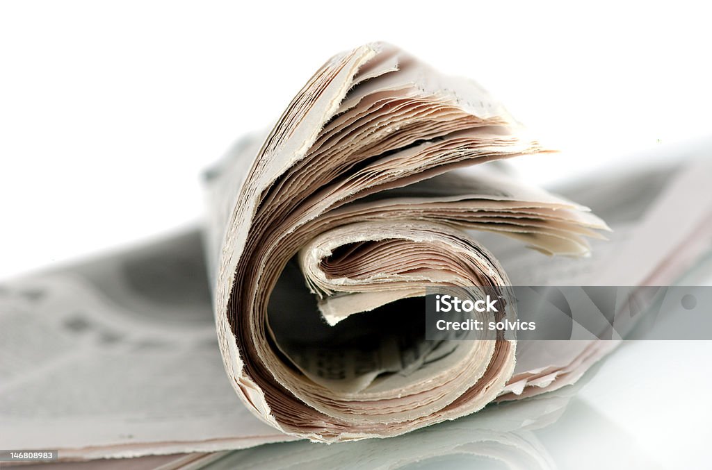 The newspaper The thick curtailed newspaper on a white background Article Stock Photo