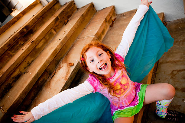 Young redhead girl embracing life with enthusiasm stock photo