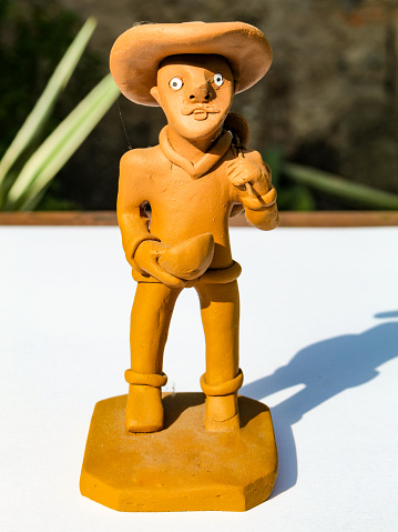 A souvenir sold to tourists at the market in Fortaleza, Ceará, Brazil, is the clay doll that portrays the Northeastern man.