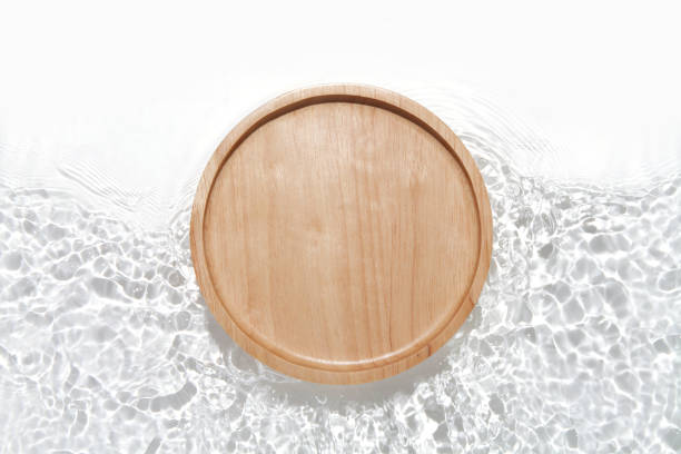 istock Wooden plate on the water surface background. Flat lay, copy space. 1468091221