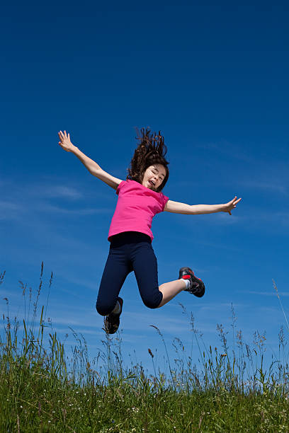 istock Girl jumping outdoor 146809370