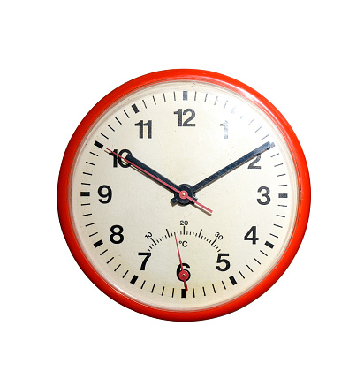 Red retro alarm clock at twelve o'clock, isolated on white background. Midnight, midday. Minutes about New year.