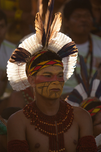 Cuiaba,MT,Brazil - Abril 19, 2013: Portrait of a Brazilian indigenous man while watching other tribes perform sports during the celebration of the indigenous day.