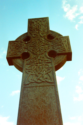 Celtic cross against blue sky in Brighton Cemetery, Victoria, Australia