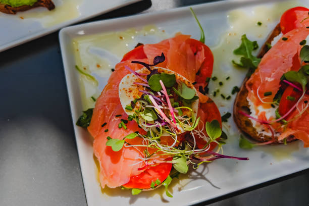Toast with salmon, tomato, egg and micro green