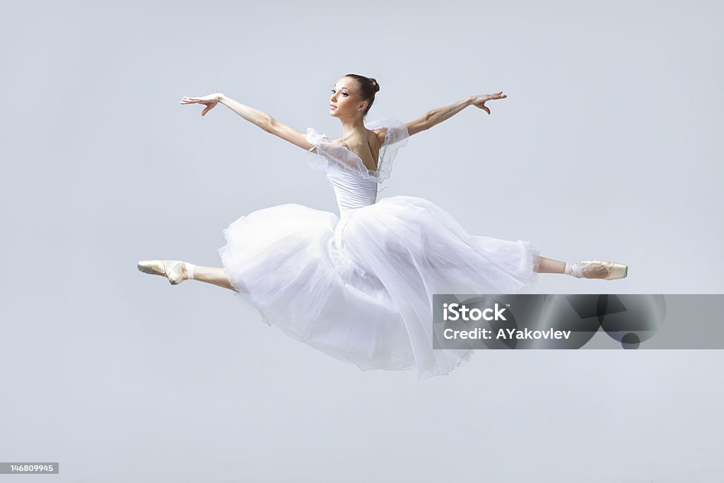 the dancer young beautiful ballerina posing in front of gray studio background Ballet Stock Photo