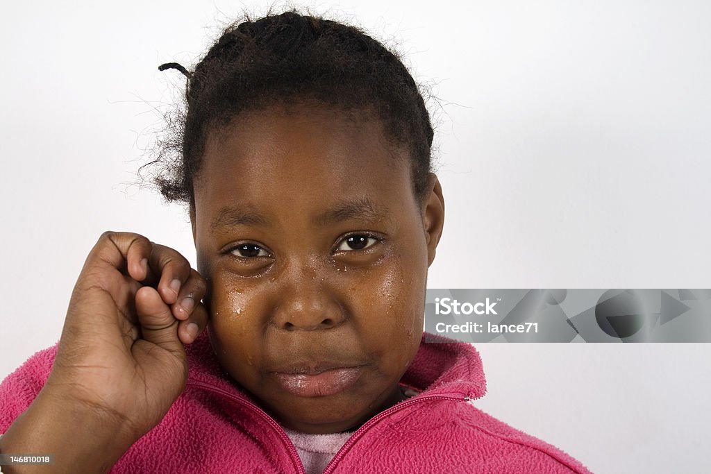 Girl Crying Young African girl crying and wiping tears Girls Stock Photo