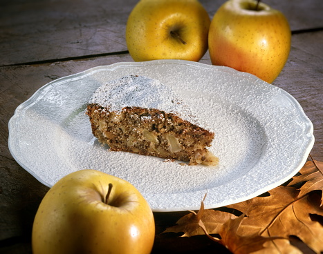 apple cake (apple apfel kuchen), fresh apples on a wooden background.