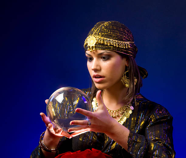 istock Woman dressed as a fortune teller reading a crystal ball 146810185